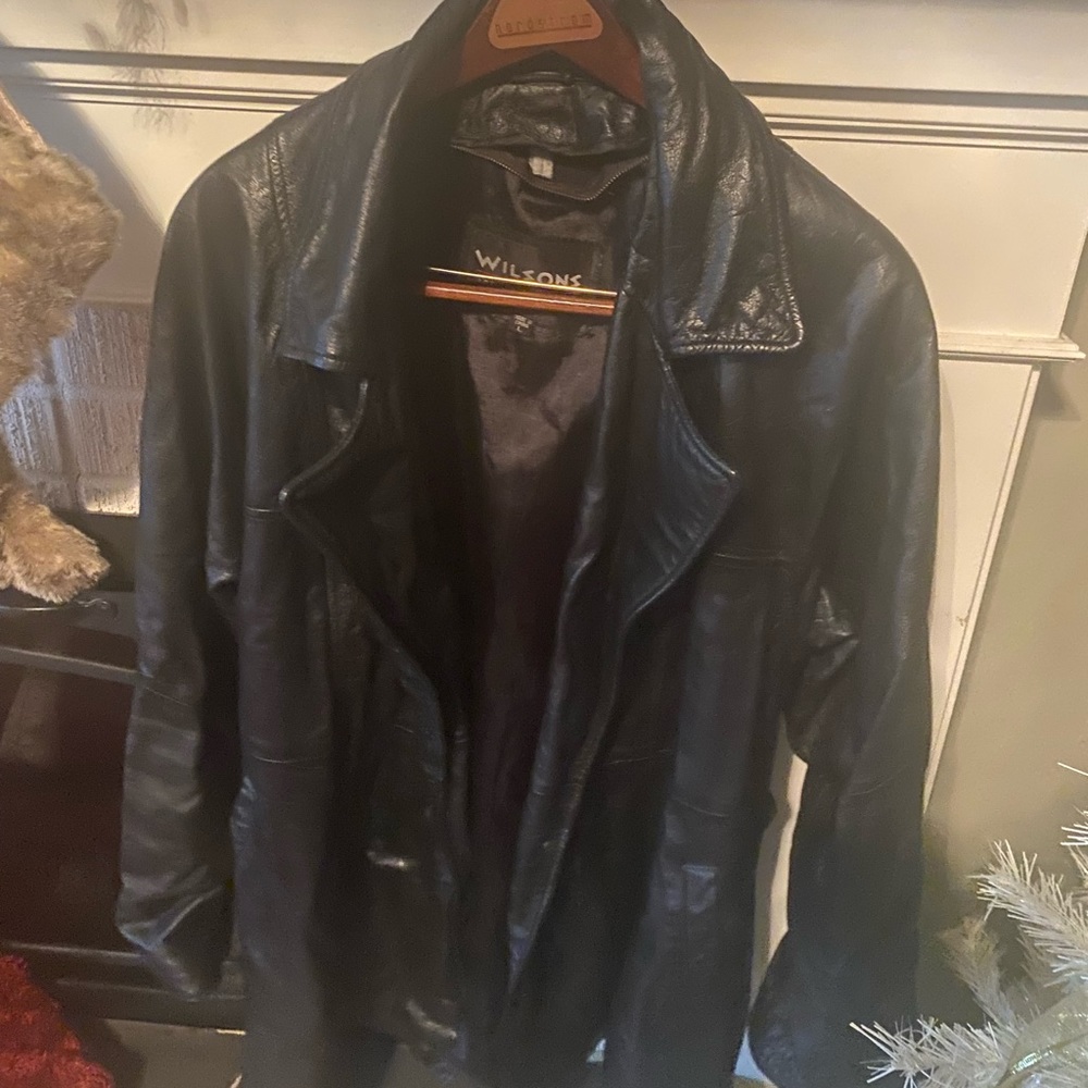Wilson’s black leather jacket with tie in back